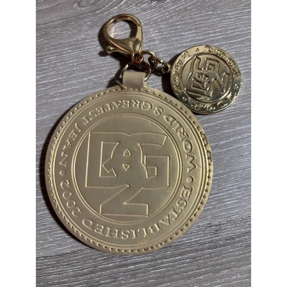 Diane‎ Gilman DG2 Gold Toned Medallion Bag Charm Keychain World's Greatest Jean